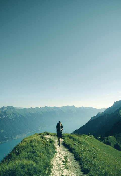 a man is walking over Mountains